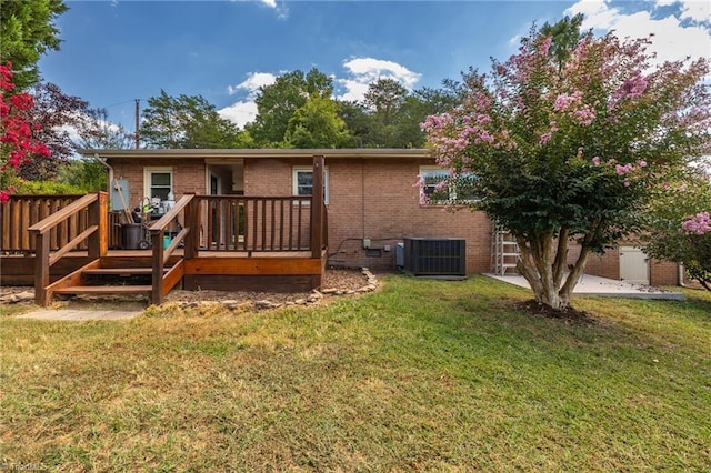 back of property featuring cooling unit, a patio area, a deck, and a yard