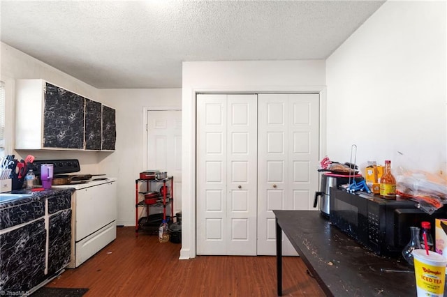 3410 Lambeth St, Winston-Salem, NC 27107 - kitchen with white range with electric cooktop, black microwave, wood finished floors, and a textured ceiling