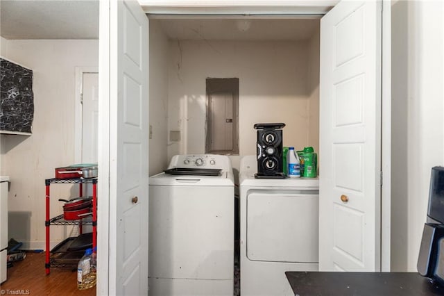 3410 Lambeth St, Winston-Salem, NC 27107 - laundry area featuring electric panel, washing machine and dryer, and wood finished floors