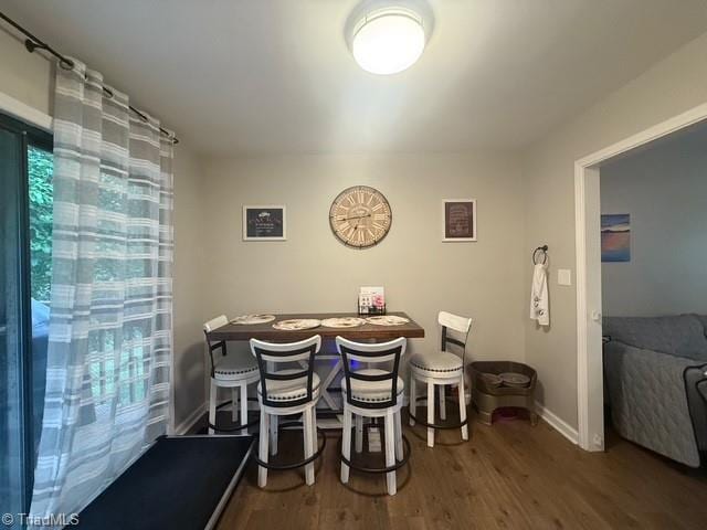 7098 E Fork Rd, High Point, NC 27265 - dining space featuring wood finished floors and baseboards