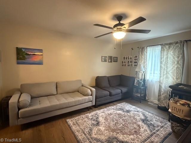 7098 E Fork Rd, High Point, NC 27265 - living room featuring ceiling fan and wood finished floors