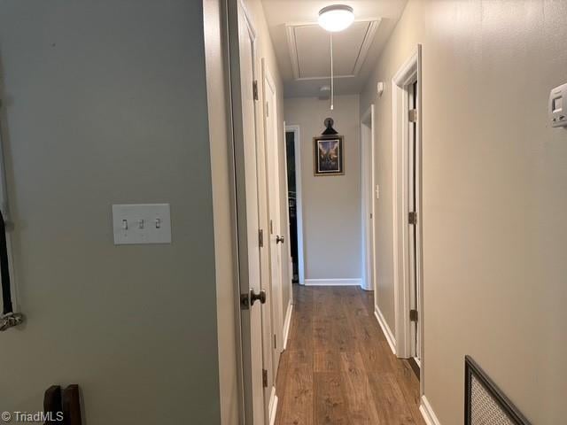 7098 E Fork Rd, High Point, NC 27265 - hallway with attic access, wood finished floors, and baseboards