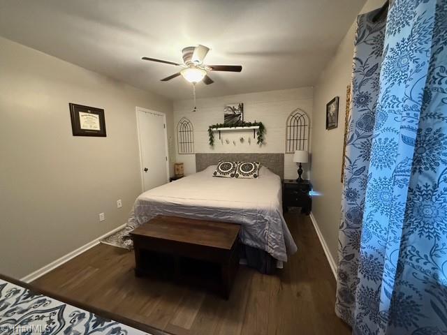7098 E Fork Rd, High Point, NC 27265 - bedroom featuring wood finished floors, baseboards, and a ceiling fan