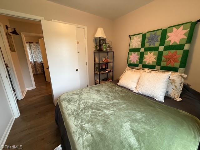 7098 E Fork Rd, High Point, NC 27265 - bedroom with wood finished floors and baseboards