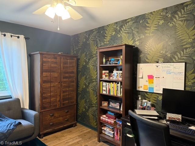 7098 E Fork Rd, High Point, NC 27265 - office with wood finished floors, ceiling fan, and wallpapered walls