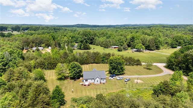 bird's eye view featuring a rural view and a forest view