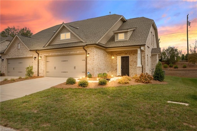 6823 Magnolia Park Ct, Clemmons, NC 27012 - view of front facade featuring an attached garage, driveway, brick siding, roof with shingles, and a lawn