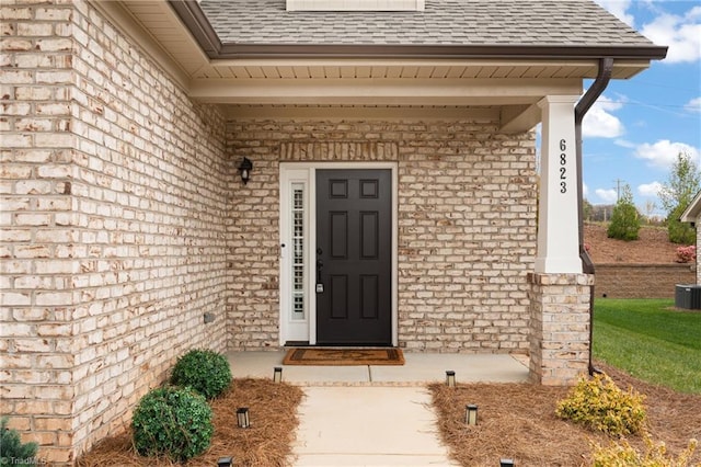 6823 Magnolia Park Ct, Clemmons, NC 27012 - view of exterior entry featuring roof with shingles and brick siding
