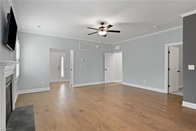 6823 Magnolia Park Ct, Clemmons, NC 27012 - unfurnished living room with ceiling fan, a fireplace with flush hearth, wood finished floors, and ornamental molding