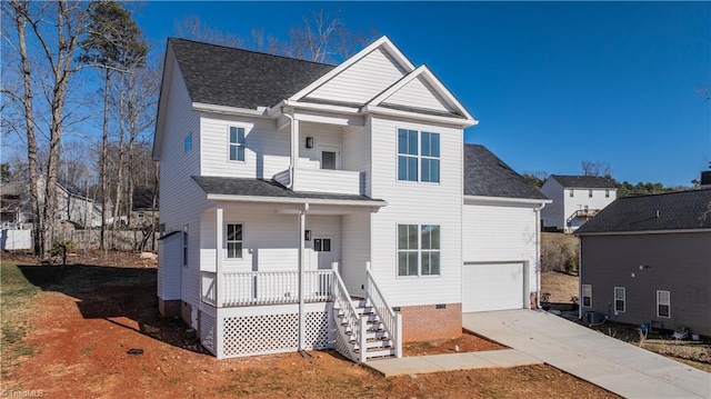 view of property featuring a garage and a porch