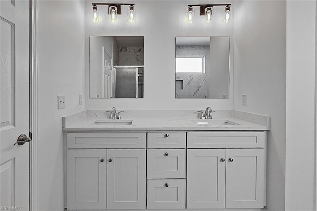 bathroom with an enclosed shower and vanity