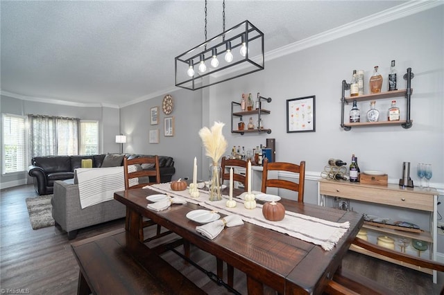 dining area featuring a textured ceiling, crown molding, and dark wood-type flooring