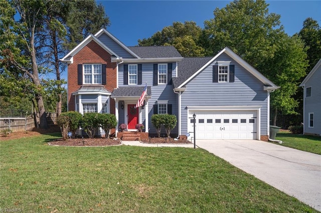 view of front of house with a garage and a front lawn