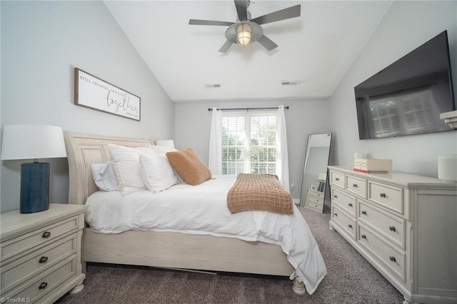 bedroom with lofted ceiling, ceiling fan, and dark carpet