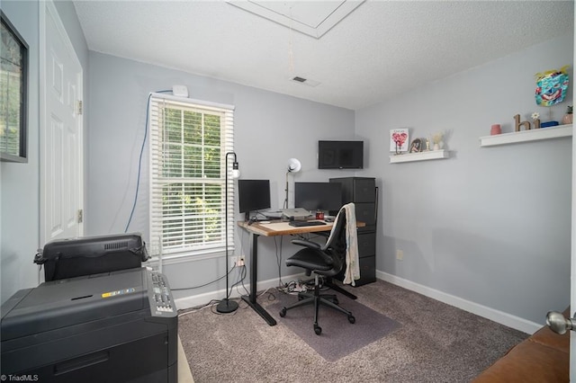 carpeted home office with a textured ceiling