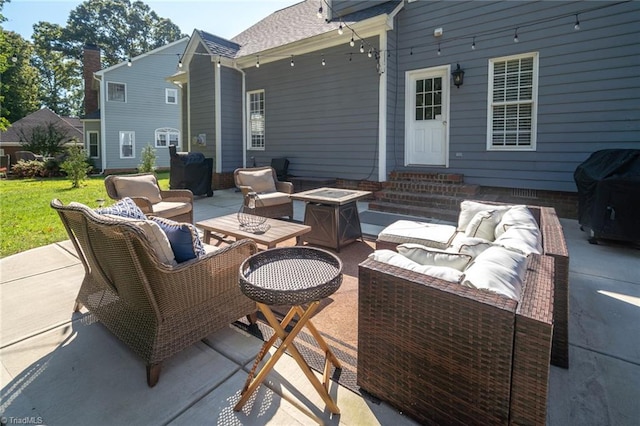 view of patio / terrace with an outdoor living space with a fire pit and a grill