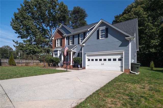 view of front of house with a front yard and a garage