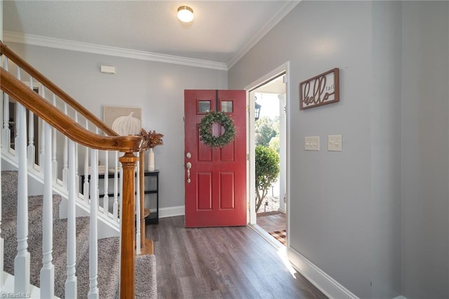 foyer entrance featuring ornamental molding and hardwood / wood-style floors