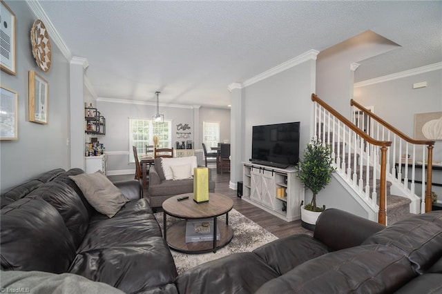 living room with hardwood / wood-style flooring and ornamental molding