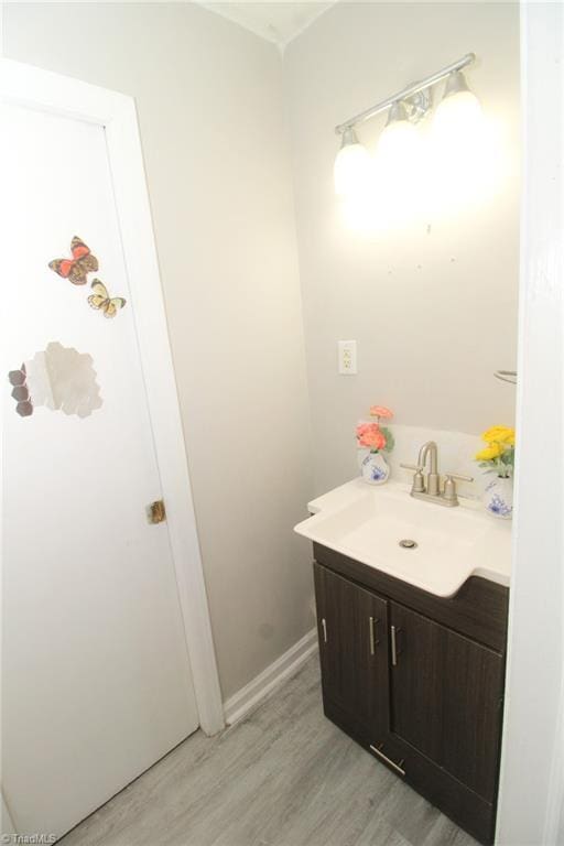 bathroom featuring hardwood / wood-style floors and vanity