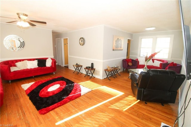 living room featuring hardwood / wood-style flooring and ceiling fan