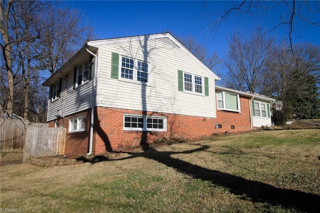 view of home's exterior with a yard