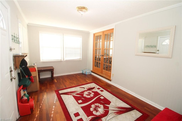 interior space featuring french doors, dark hardwood / wood-style floors, and ornamental molding