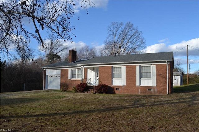 view of front of home featuring a front yard and a garage