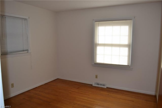 unfurnished room featuring light wood-type flooring