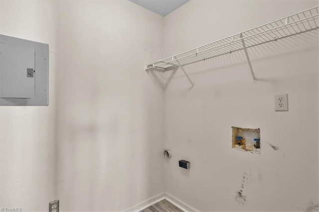 3638 Morris Farm Dr, Greensboro, NC 27409 - laundry room with electric panel, washer hookup, electric dryer hookup, baseboards, and wood finished floors