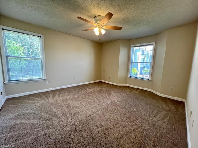 3638 Morris Farm Dr, Greensboro, NC 27409 - carpeted spare room with plenty of natural light, baseboards, a ceiling fan, and a textured ceiling