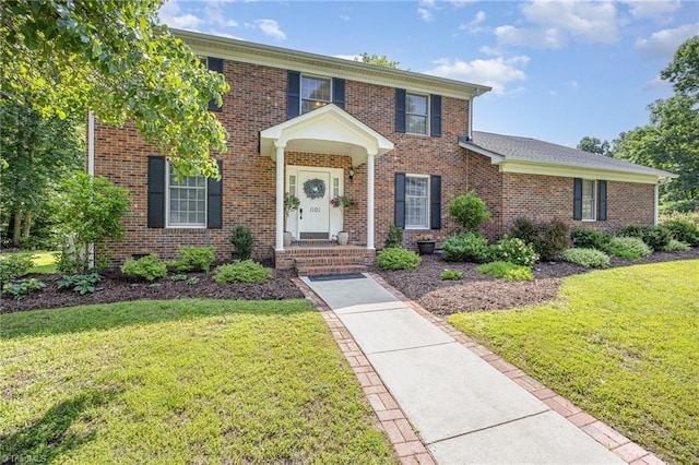 1101 Shalimar Ct, High Point, NC 27262 - colonial house featuring a front yard and brick siding