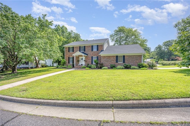 1101 Shalimar Ct, High Point, NC 27262 - colonial-style house featuring a front yard and brick siding