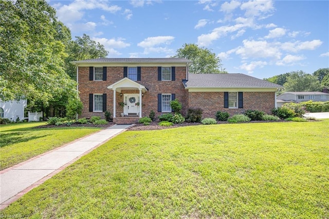 1101 Shalimar Ct, High Point, NC 27262 - colonial house with a front yard and brick siding