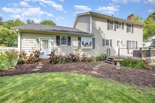 1101 Shalimar Ct, High Point, NC 27262 - rear view of house featuring a chimney, a lawn, and a deck