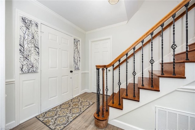 1101 Shalimar Ct, High Point, NC 27262 - entryway with wood finished floors, crown molding, and stairs