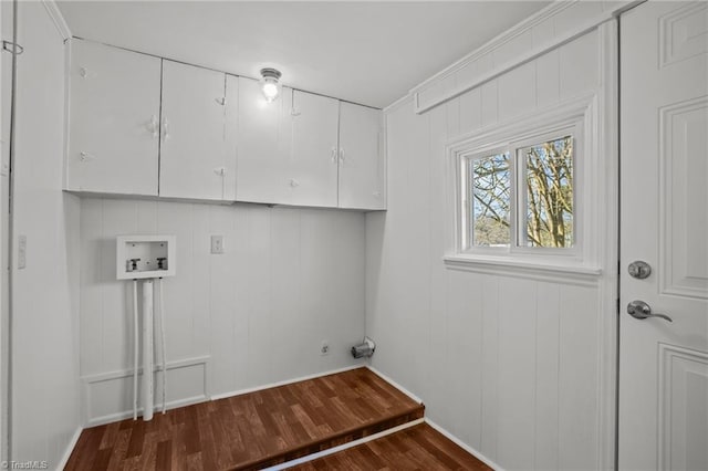 laundry room with cabinet space, washer hookup, and wood finished floors