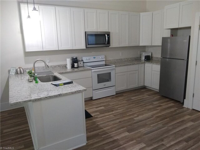 kitchen featuring sink, stainless steel appliances, dark wood-type flooring, and white cabinetry