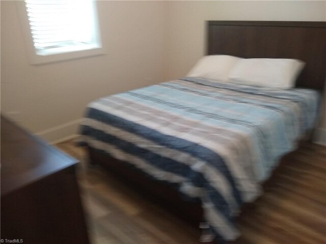 bedroom featuring wood-type flooring