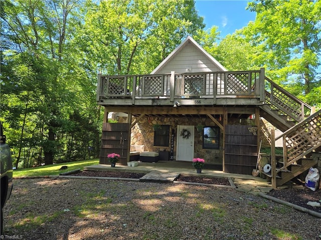 866 Trinity Church Rd, Tobaccoville, NC 27050 - rear view of property featuring stairs, a deck, a patio, and stone siding
