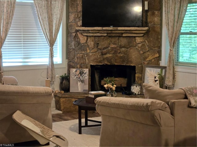 866 Trinity Church Rd, Tobaccoville, NC 27050 - living room with wood finished floors, healthy amount of natural light, and a fireplace
