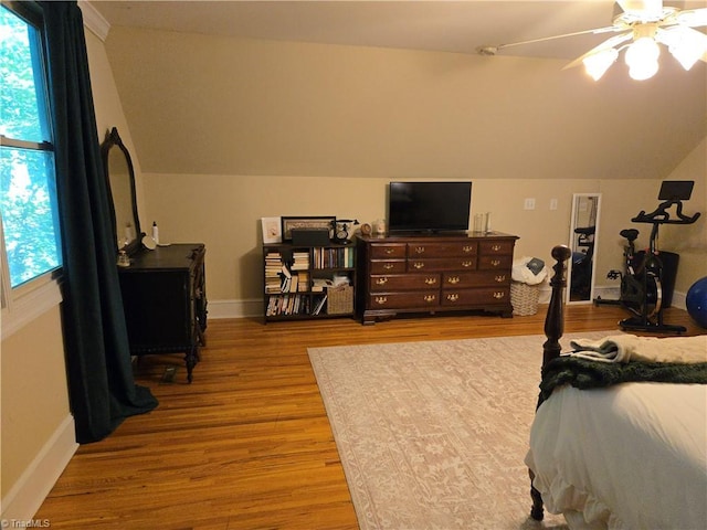 866 Trinity Church Rd, Tobaccoville, NC 27050 - bedroom with lofted ceiling, wood finished floors, multiple windows, and baseboards