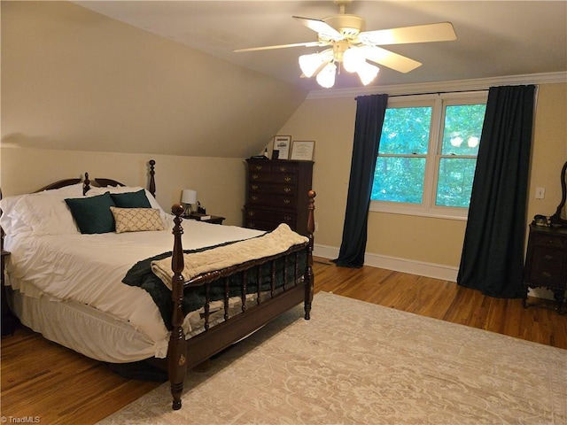 866 Trinity Church Rd, Tobaccoville, NC 27050 - bedroom with wood finished floors, baseboards, a ceiling fan, and lofted ceiling