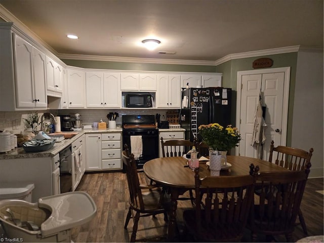 866 Trinity Church Rd, Tobaccoville, NC 27050 - kitchen featuring black appliances, a sink, dark wood-style flooring, crown molding, and white cabinetry