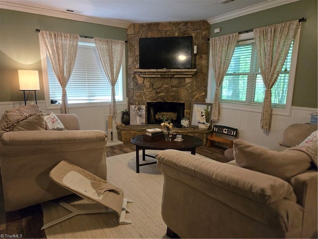 866 Trinity Church Rd, Tobaccoville, NC 27050 - living room featuring a wainscoted wall, wood finished floors, crown molding, and a fireplace