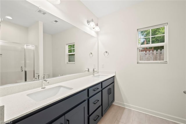 2109 Freeman St, Winston-Salem, NC 27127 - bathroom with double vanity, a shower stall, plenty of natural light, and tile patterned flooring