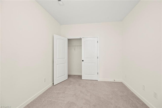 2109 Freeman St, Winston-Salem, NC 27127 - unfurnished bedroom with light colored carpet and a closet