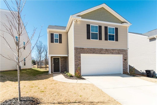 view of front of property featuring a front lawn, stone siding, a garage, and driveway