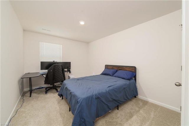 bedroom featuring visible vents, baseboards, and carpet flooring