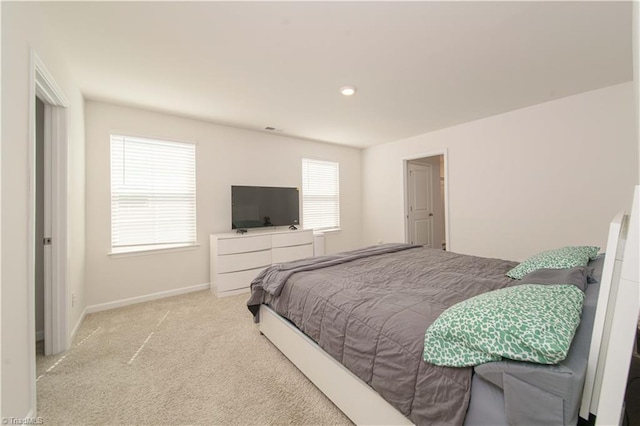 bedroom with baseboards and carpet floors